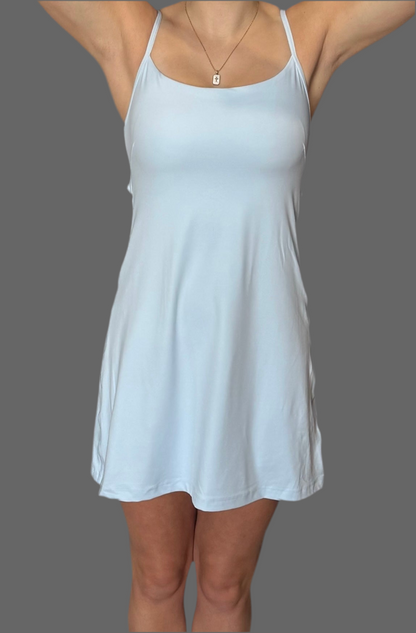 Front view of baby blue Athena Active Dress by Sportik athletikS – lightweight, breathable women’s athletic dress with built-in shorts and spaghetti straps