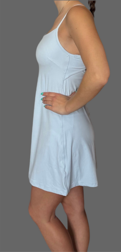 Side view of baby blue Athena Active Dress from Sportik athletikS, form-flattering fit with built-in shorts and breathable fabric for active lifestyles